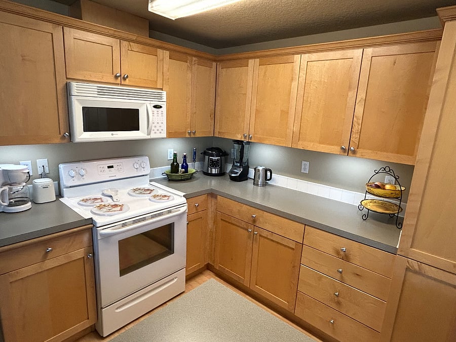 Full Kitchen - microwave, electric stove/oven; dishwasher and an adjacent laundry room with full-size washer and dryer. You'll have your own designated cupboard spaces.