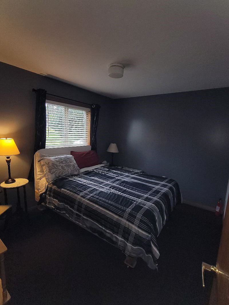 Quiet must comfortable queen bed. New bedding, bathroom is beyond. Apt is a U shape. 