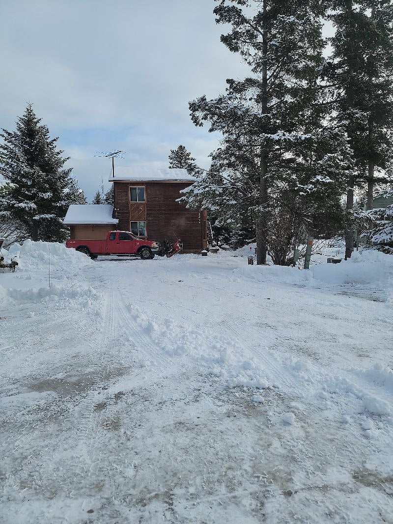 Front view of house from cul-de-sac. Entrance to the right. Good job plow man
