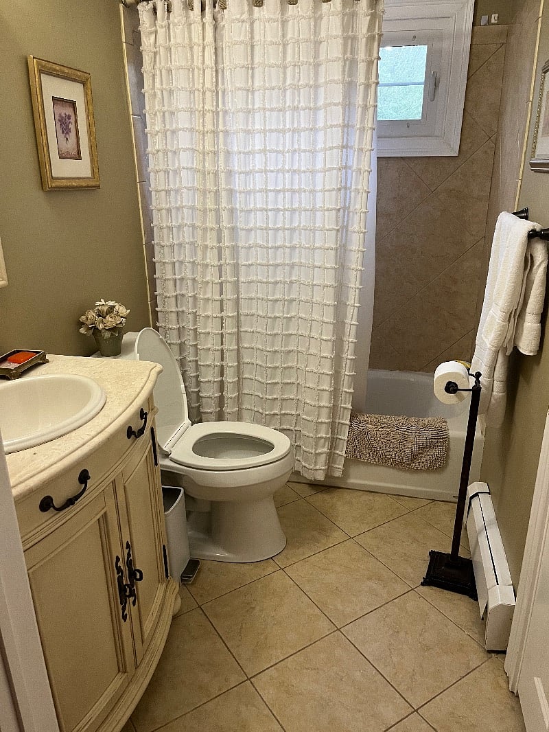 Master bedroom bathroom with tub and shower first floor.