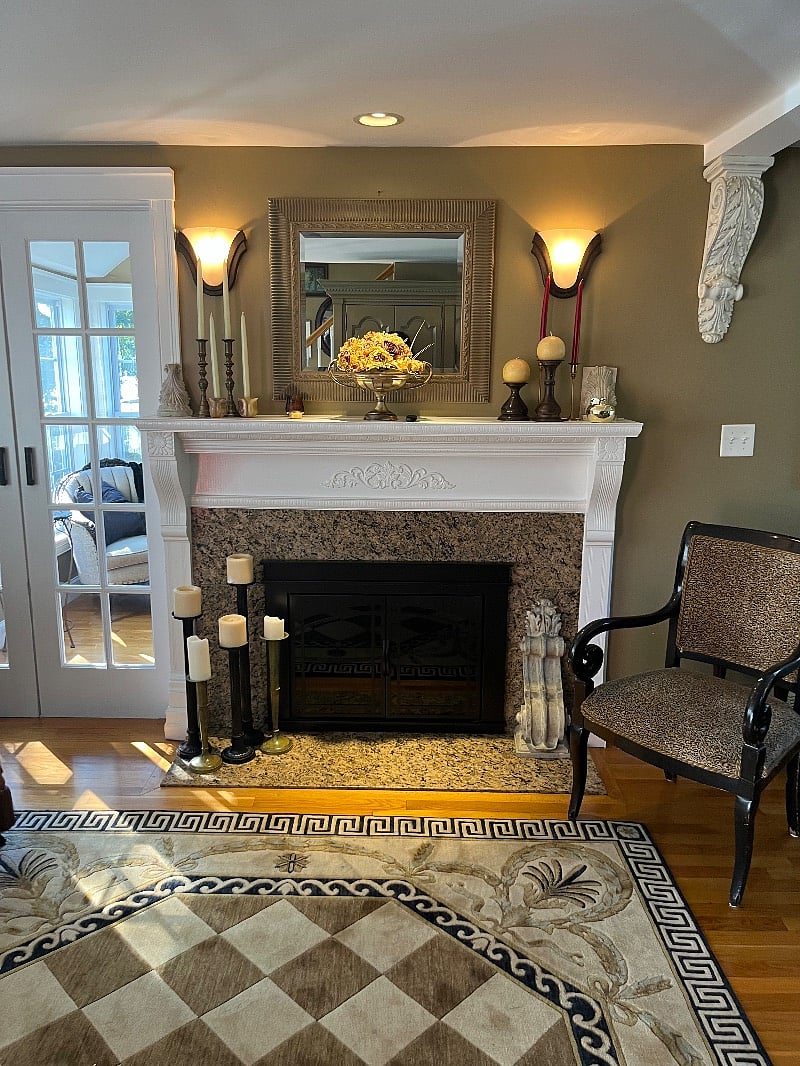 Remote gas fireplace adjacent to sunroom.