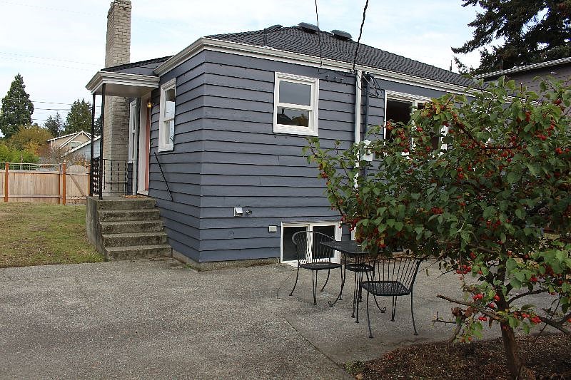 There's a lovely patio off the side door, great for hanging out in the warm months. Screening and more furniture will be added for privacy and comfort in the spring/summer.
