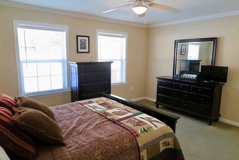 Master Suite bedroom with two dressers a large closet and full ensuite. Each bedroom has its own thermostat.