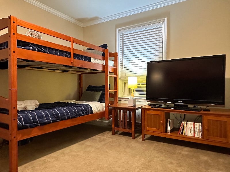 Our Double Bunk Bedroom sleeps four adults (or children) and includes a play area (big enough to play twister) and a large screen TV. Each bedroom has its own thermostat.
