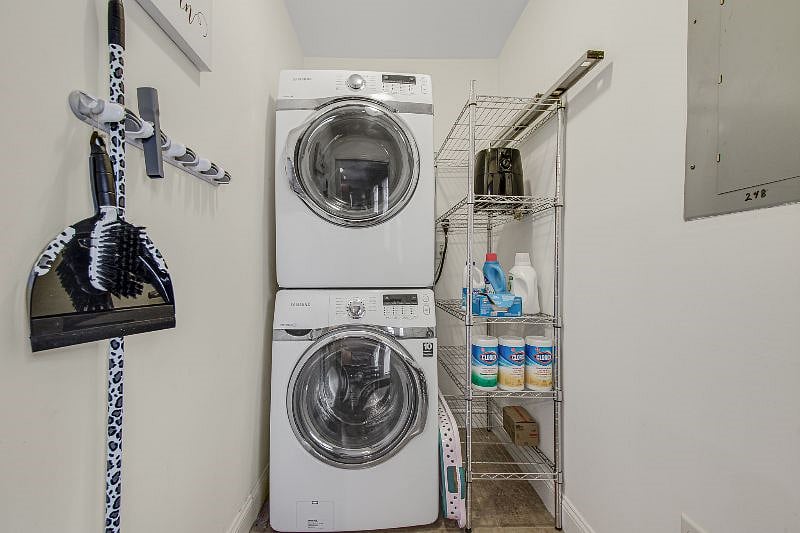 Utility room with washer and dryer- in unit