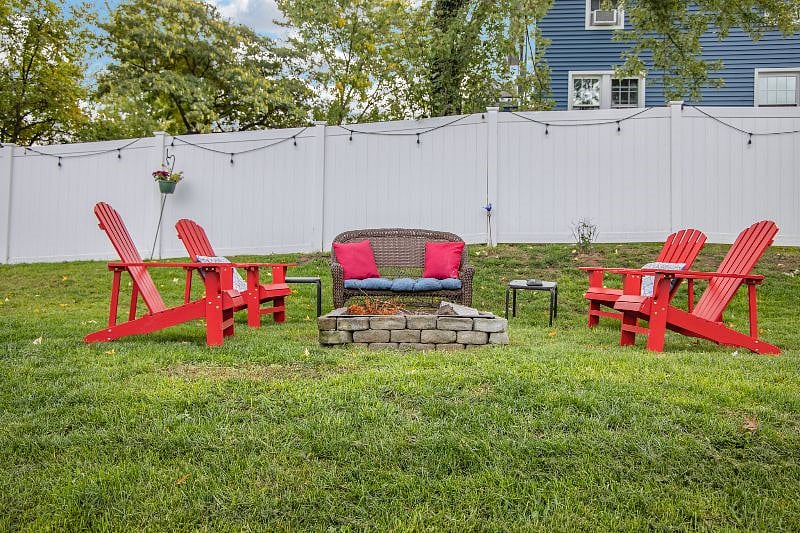 Backyard open wood firepit and seating area