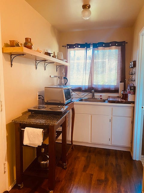 While the kitchenette is compact and simple, you can definitely cook a nice meal in it. The oven has option for regular, convection, broil or toast and you will be amazed but you can make a whole dinner in there or bake a cake! The electric kettle is ready for your tea and there is a 2 burner cooktop that usually does the trick.
