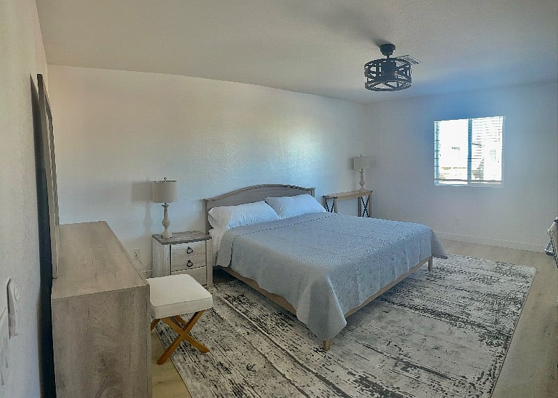 Master bedroom! Perfect for traveling couple needing lots of space! Or for one who likes the whole bed to themselves!! Standing at the door looking in, ensuite bathroom to the right