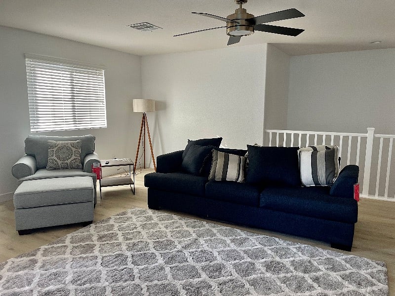 Living area next to the master bedroom! The rail overlooks the front entrance 