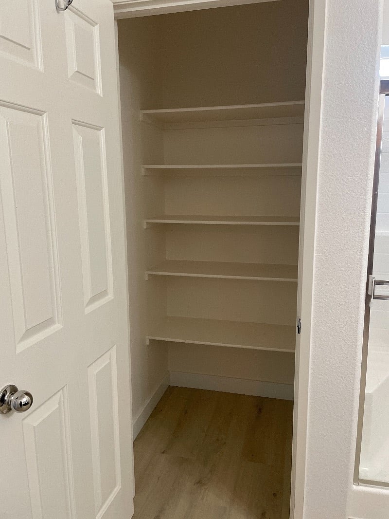 Extra storage closet in the bathroom next to the shower! 