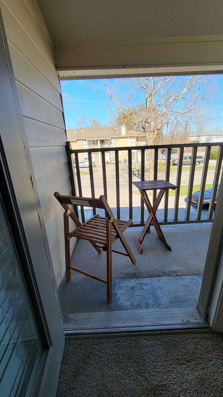 Balcony off the upstairs bedroom with two chairs and a small table to enjoy your own private outdoor space.