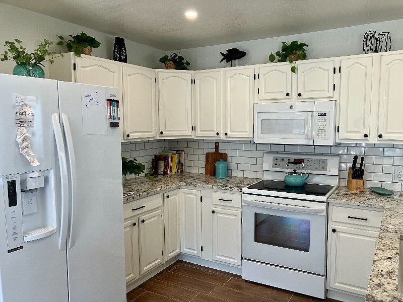 The kitchen is fully updated with granite countertops and everything you need to whip up and serve fabulous meals!
