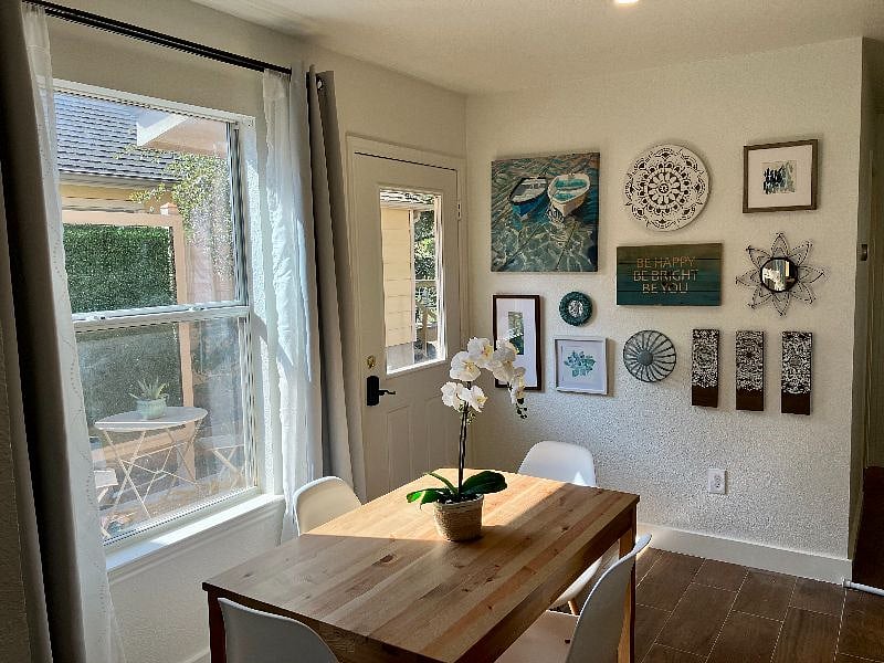 The sunny dining area, with access to the patio for outdoor dining/relaxing.