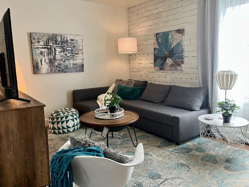 The cozy family room features a queen-sized pull-out sofa for extra sleeping space.