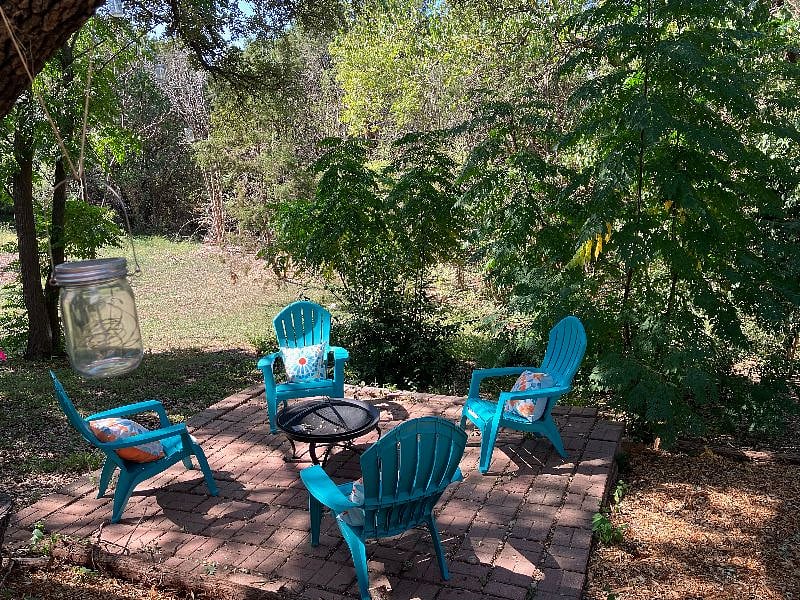The backyard overlooks a greenbelt with a wet-weather creek for nature watching, relaxing, and hanging out.