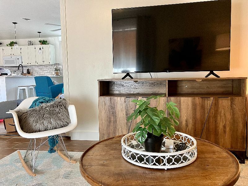 The family room features a 55-inch flatscreen smart TV.