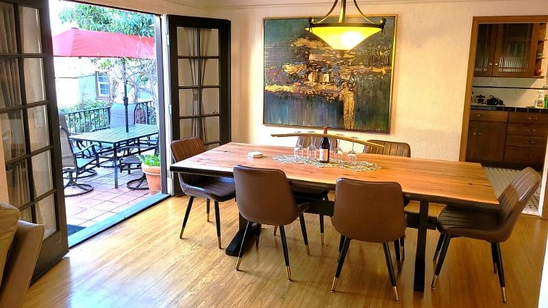 Dining room with french doors open to patio dining area