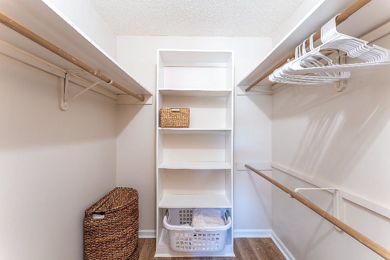 Stay organized with a spacious walk-in closet featuring plenty of hangers and ample storage for all your belongings.