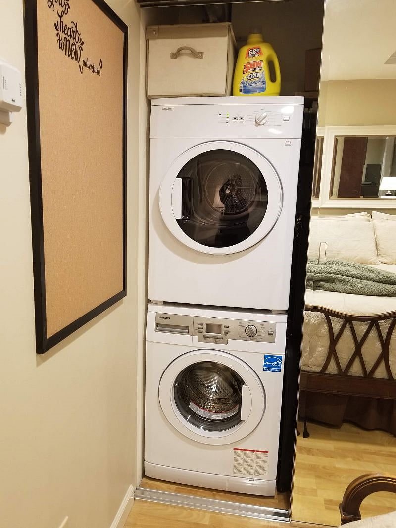 Washer and dryer in bedroom closet.