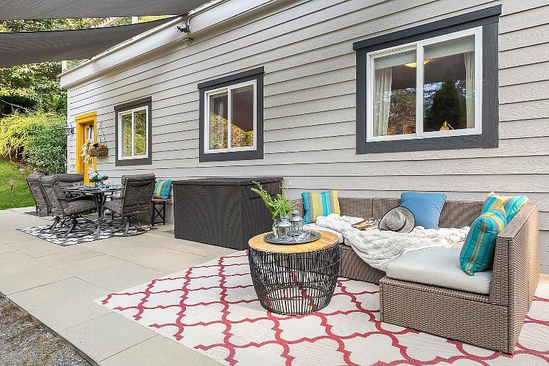 Additional sectional seating on patio with round table for coffee or beverages, or just a relaxing day of reading or catching a nap.