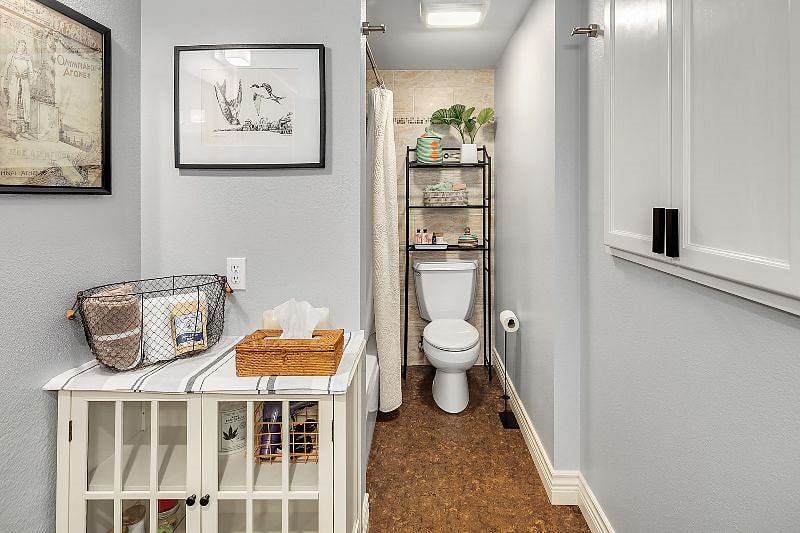 Tub and Shower to the left of the toilet. Large in-wall storage cabinet (to the right) for towels, bathmats, toiletries, etc. 4 large bath towels, 6 hand towels, and 8 washcloths, 2 bathmats, and 1 non-slip bathtub mat are provided. Additional freestanding cabinet for yet more storage capabilities.