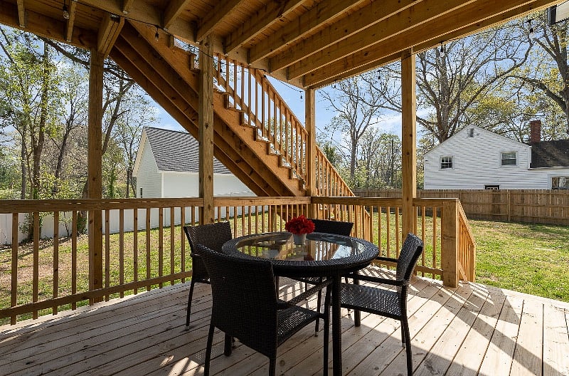 Enjoy the beautiful NC weather on your private deck with patio seating and cafe lights - just off the living room.