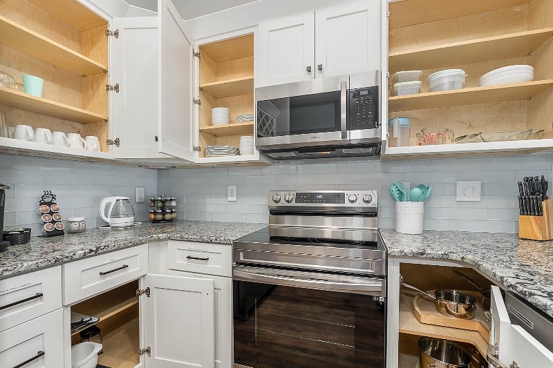 Well-equipped kitchen with pots & pans, dishes, utensils, coffee mugs, wine glasses, storage containers and more!