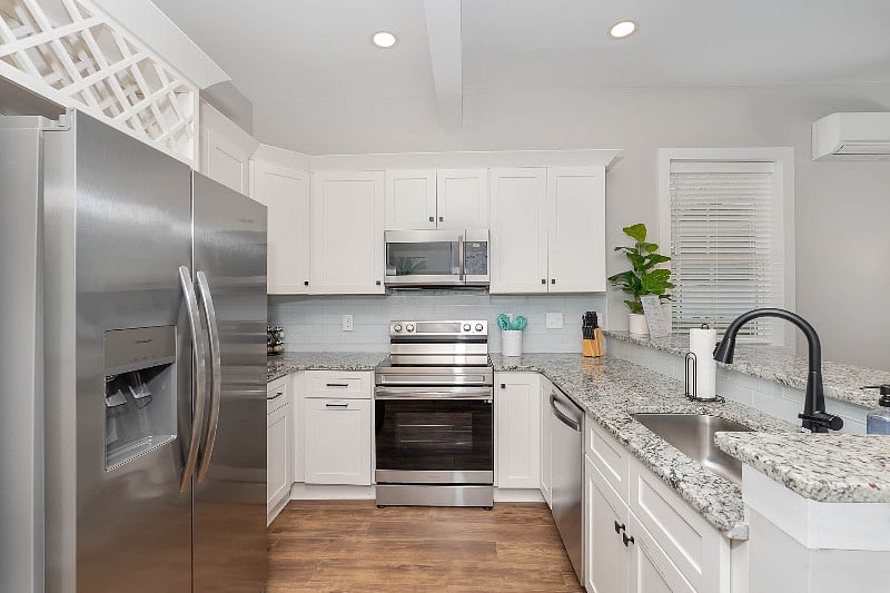 Enjoy the full-sized kitchen with new refrigerator & ice maker (in the door!), microwave, dishwasher and stove with air fryer. 