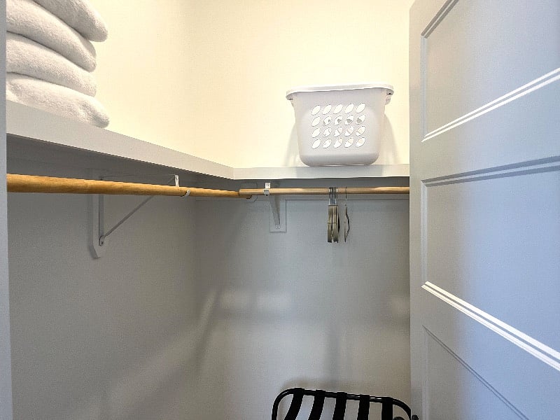 Spacious walk-in closet, extra linens and laundry basket.