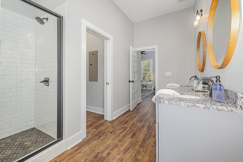 Large en-suite bathroom with hallway entrance for additional privacy when entertaining.