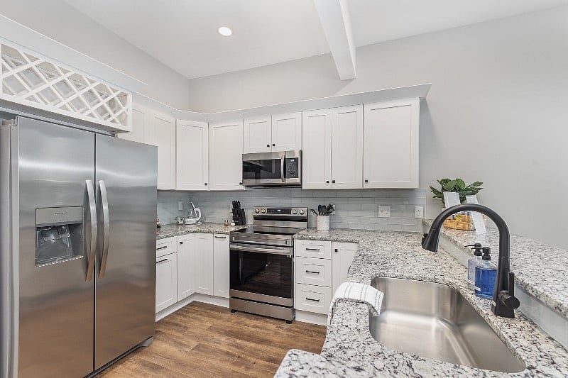 Well-equipped kitchen with SS appliances, including microwave, dishwasher, range with air-fryer feature, fridge with in-door ice and water dispenser and much more.