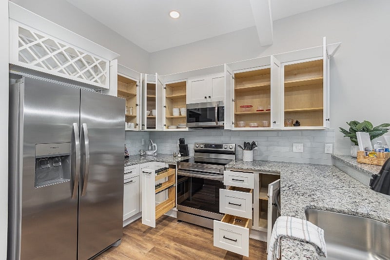 Well-equipped and labeled kitchen cabinets make meal prep and clean-up a breeze.