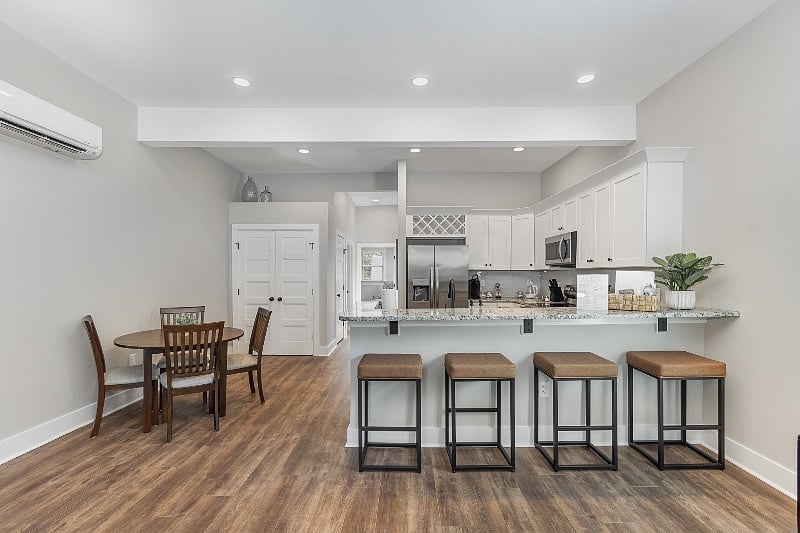Spacious and open-concept living, dining and kitchen. Multiple seating options, including dining table & bar stools for 4.
