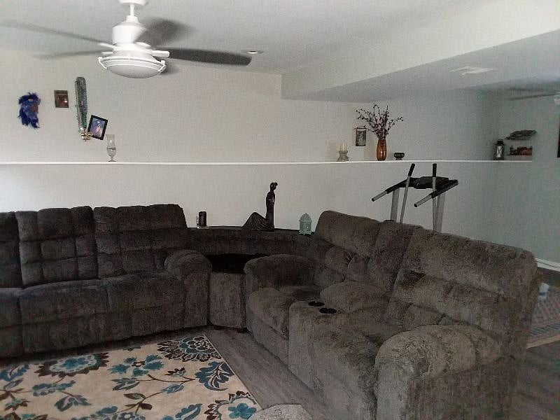 Lower level living space w/ walkout access to back yard. Sectional corner space has USB and plug in access.