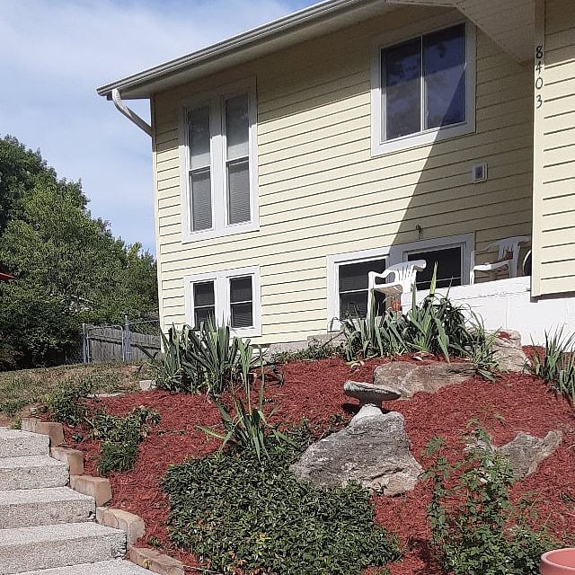 Front tiered garden, steps to front door of property. Exterior maintenance provided.