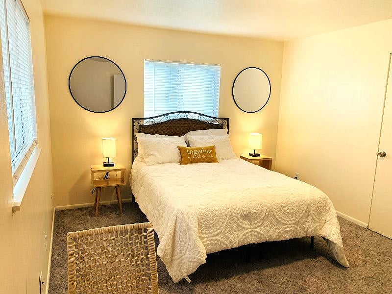 Bedroom 1, sitting area, dresser and closet.