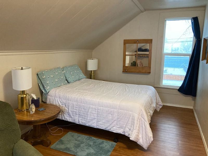Here is west side of the bedroom above the living room - This room has a really nice adjustable full sided bed, nice end tables and a big window.
There is a large dresser and a short/half sided closet on the other side of the room - to be posted soon.