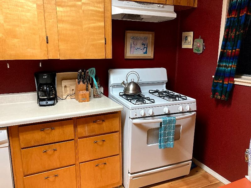The kitchen is full equipped with a gas stove and many cabinets filled with all the dishes, an instapot, stainless steel pots and glass pans, all your cooking, baking and eating pleasure.