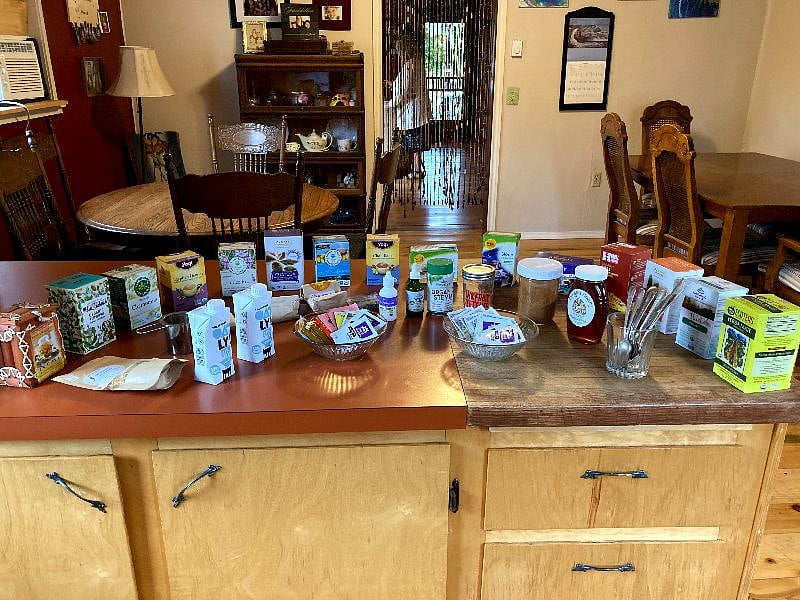 Between the dining area and the kitchen is this huge cabinet with expansive counter space which has served many teas and potlucks
