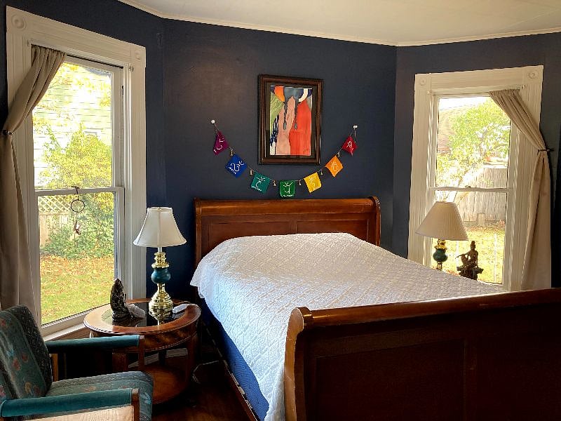This is the same view but with the curtains drawn - the windows add a lot of light to this beautiful space - in the summer a air conditioning unit is placed in one of the windows.