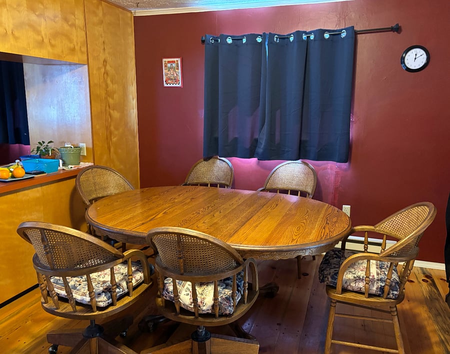 Walk through the large 11x22 living room into the large 18x25 dining room and kitchen and you are welcomed to eat at this beautiful oak table.
