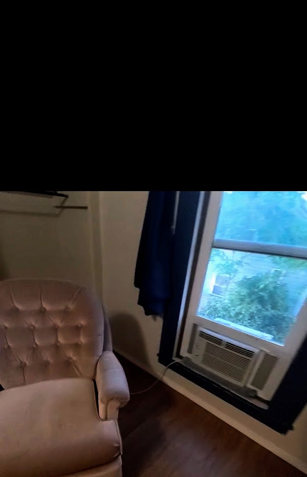 There is a AC unit installed in this large window. 
