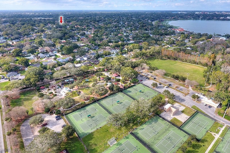 Our Cottage (Red Arrow) and The Publix public park, with tennis courts and a huge children's playground; a short 5 minute drive from our Cottage.