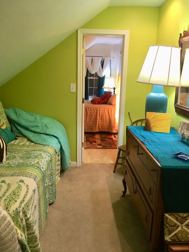 Private narrow green rentable bedroom on 2nd floor is furnished with twin bed with separate room for small office or crafting.