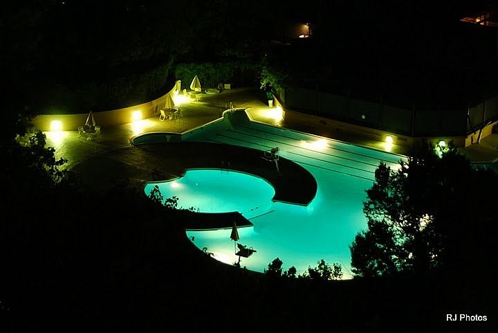 Night view of outdoor pool.