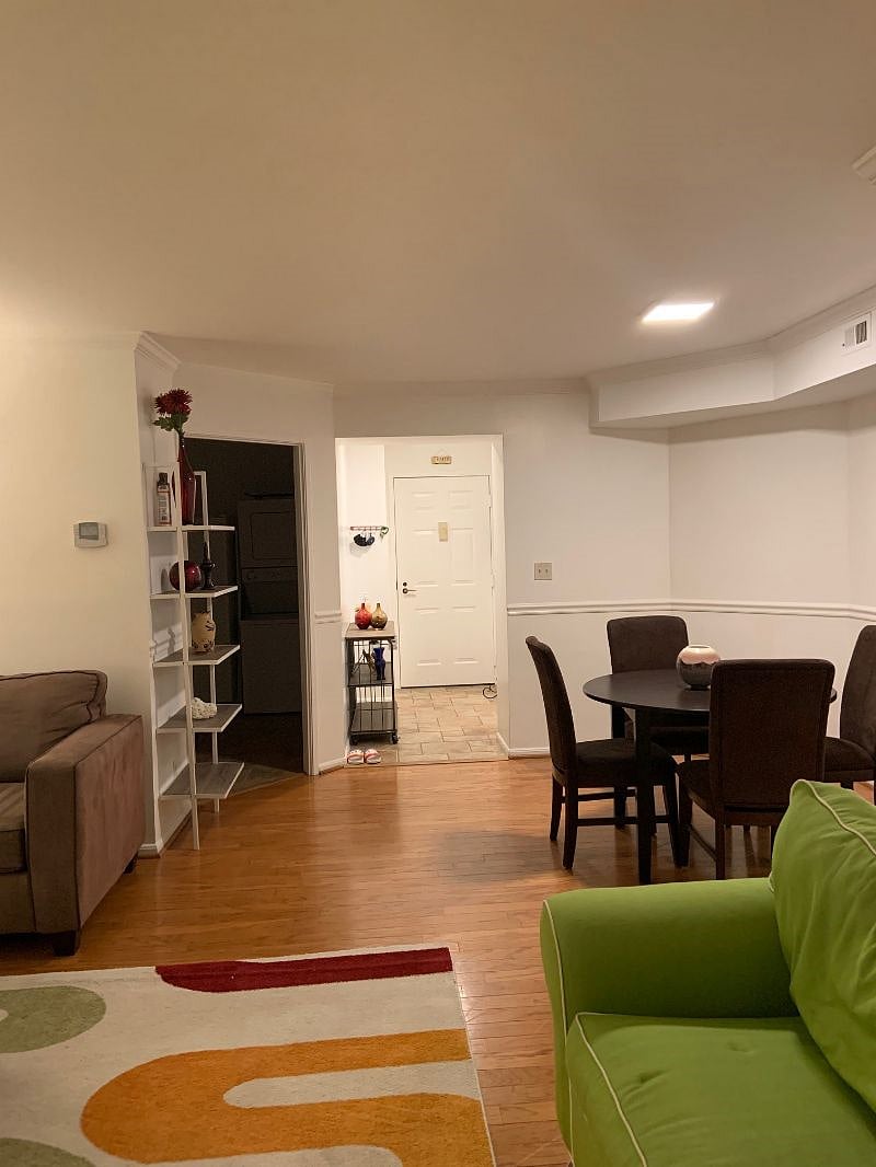 This is the entrance of the unit. The entrance door is in the far center. The entrance to the kitchen is to the left.
