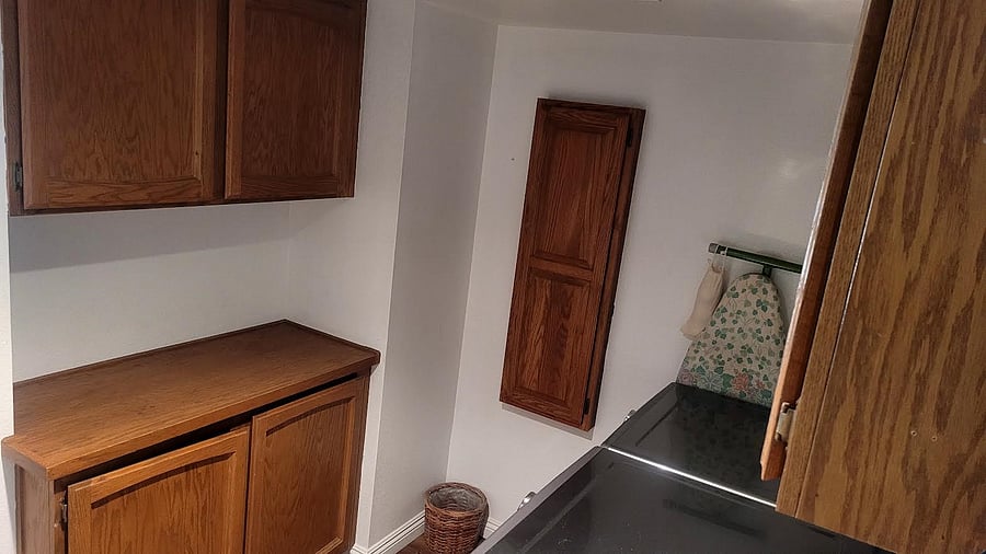 You have a shelf in the upper left cupboard for your laundry supplies. Use of 2 different size ironing boards.
