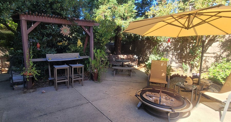 Whether you sit under the trees or under the sky, our back yard is quite relaxing and secure for your pup.