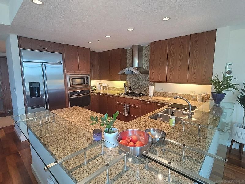 Full-size kitchen with appliances, dishware and silverware
