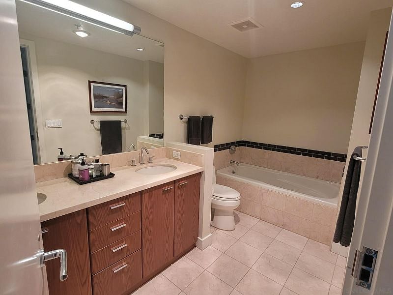 Master Bathroom with double sinks, shower, separate tub